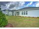 Spacious backyard featuring a well-maintained lawn and patio area, perfect for outdoor activities at 603 Dunswell Dr, Summerville, SC 29486