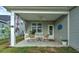 Cozy covered backyard patio with comfortable seating, plants, and a ceiling fan for relaxation at 603 Dunswell Dr, Summerville, SC 29486