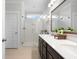 Bright bathroom featuring dual sinks, a walk-in shower with subway tile, and ample counter space at 603 Dunswell Dr, Summerville, SC 29486