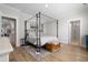 Spacious bedroom featuring a four poster bed, wood flooring and neutral decor at 603 Dunswell Dr, Summerville, SC 29486
