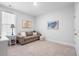 Bright bedroom with a comfortable couch and ample space for relaxation or a home office at 603 Dunswell Dr, Summerville, SC 29486