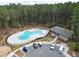 Aerial view of resort-style community pool with lounge chairs and shaded picnic area at 603 Dunswell Dr, Summerville, SC 29486