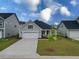 Charming home with a well-manicured lawn, two-car garage, and inviting front porch at 603 Dunswell Dr, Summerville, SC 29486