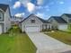 Beautiful home featuring a well-manicured lawn, concrete driveway, and an attached two-car garage at 603 Dunswell Dr, Summerville, SC 29486