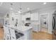 Stylish kitchen featuring a center island with seating, pendant lights, and modern appliances at 603 Dunswell Dr, Summerville, SC 29486