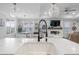 Bright kitchen featuring white cabinets, marble countertops, pendant lighting, and stainless steel appliances at 603 Dunswell Dr, Summerville, SC 29486