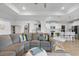 Comfortable living room with a plush sectional sofa and open access to a modern, well-lit kitchen at 603 Dunswell Dr, Summerville, SC 29486