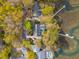 Aerial view reveals private dock, neighboring homes and scenic streets lined with mature trees at 630 Cain Dr, Mount Pleasant, SC 29464