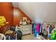 Attic closet with sloped ceilings and ample clothing storage at 630 Cain Dr, Mount Pleasant, SC 29464