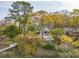 Lush backyard featuring a patio, outdoor fireplace, and private dock access at 630 Cain Dr, Mount Pleasant, SC 29464