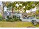 Backyard with deck, outdoor kitchen, fire pit, and beautiful landscaping at 630 Cain Dr, Mount Pleasant, SC 29464