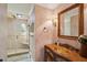 Stylish bathroom showcasing a tiled shower, unique vanity, and decorative mirror at 630 Cain Dr, Mount Pleasant, SC 29464