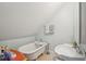 Bright attic bathroom featuring a clawfoot tub and vanity sink at 630 Cain Dr, Mount Pleasant, SC 29464