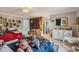 Large bedroom with multiple beds, a bookshelf wallpaper and sitting area at 630 Cain Dr, Mount Pleasant, SC 29464