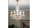 A chandelier has an ornate design with crystals that glimmer in the light at 630 Cain Dr, Mount Pleasant, SC 29464