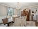 Charming dining room boasting a chandelier, hardwood floors, and bright window at 630 Cain Dr, Mount Pleasant, SC 29464
