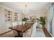 Elegant dining room featuring a chandelier, hardwood floors, and a rustic wooden table at 630 Cain Dr, Mount Pleasant, SC 29464
