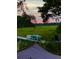 Waterfront home with boat, kayak, dock and seating overlooking a pristine, green marshland at 630 Cain Dr, Mount Pleasant, SC 29464