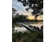 Waterfront home features a long private dock with a boat and chairs to relax and enjoy the view at 630 Cain Dr, Mount Pleasant, SC 29464