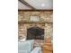 Close-up of the brick fireplace showcasing decorative details, a mantel, and an inviting ambiance at 630 Cain Dr, Mount Pleasant, SC 29464