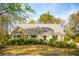 Charming single-story home with a lush landscaped yard and blooming azaleas at 630 Cain Dr, Mount Pleasant, SC 29464