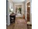 Elegant hallway with hardwood floors, a stylish rug, and a view into a bright dining area at 630 Cain Dr, Mount Pleasant, SC 29464