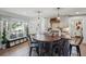 An open-concept kitchen with a large island, custom lighting, and natural light from the nearby window at 630 Cain Dr, Mount Pleasant, SC 29464