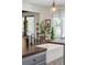 Bright and inviting kitchen island with a porcelain farmhouse sink, dark wood countertop, and a large window at 630 Cain Dr, Mount Pleasant, SC 29464