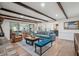 Spacious living room with exposed beams, stylish furniture, and an open layout perfect for entertaining at 630 Cain Dr, Mount Pleasant, SC 29464