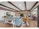 Comfortable living room showcasing a brick fireplace and sliding doors to a sunlit outdoor space at 630 Cain Dr, Mount Pleasant, SC 29464