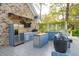Outdoor kitchen with stainless steel appliances, grill, pizza oven, and ample counter space at 630 Cain Dr, Mount Pleasant, SC 29464