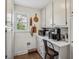 Bright pantry area featuring white cabinets, light countertops, and hardwood floors at 630 Cain Dr, Mount Pleasant, SC 29464