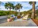 Stylish outdoor patio with comfortable seating, palm trees, and a relaxing ambiance at 630 Cain Dr, Mount Pleasant, SC 29464