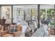 Cozy sun room with a pool table, comfortable seating, and serene views of the surrounding landscape at 630 Cain Dr, Mount Pleasant, SC 29464