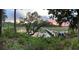 Beautiful waterfront home features a long private dock with boat, kayak and chairs at 630 Cain Dr, Mount Pleasant, SC 29464