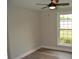 Bright bedroom with ceiling fan, neutral walls, and a large window overlooking the yard at 708 Old State Rd, Goose Creek, SC 29445