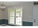 Dining room with large window for natural light and stylish two-tone walls at 708 Old State Rd, Goose Creek, SC 29445