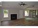 Spacious living room featuring a fireplace, wood-look flooring, and modern lighting at 708 Old State Rd, Goose Creek, SC 29445