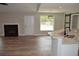 Open floor plan from kitchen into living room with fireplace at 708 Old State Rd, Goose Creek, SC 29445