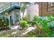 Serene backyard with lush greenery and charming seating areas at 78 Society St, Charleston, SC 29401