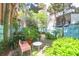 Inviting backyard featuring a cozy seating area, lush plants, and charming landscaping, creating a private outdoor retreat at 78 Society St, Charleston, SC 29401