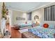 Bright bedroom featuring twin beds with hardwood floors, offering comfortable accommodations at 78 Society St, Charleston, SC 29401