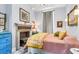 Charming bedroom with fireplace, artwork, and unique furniture at 78 Society St, Charleston, SC 29401