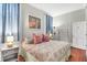 Comfortable bedroom with patterned bedding, decorative artwork, and natural light from the window at 78 Society St, Charleston, SC 29401