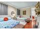 Cozy bedroom with hardwood floors showcases twin beds and a decorative fireplace at 78 Society St, Charleston, SC 29401