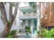 Charming two-story home with a double porch, painted in cool white and accented with turquoise trim at 78 Society St, Charleston, SC 29401