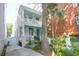 Quaint home featuring a double front porch, a lush garden, and a private side entrance at 78 Society St, Charleston, SC 29401