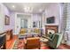 Stylish living room with comfortable seating, fireplace, and a modern aesthetic at 78 Society St, Charleston, SC 29401