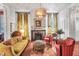 Bright living room featuring a fireplace, comfortable seating, and decorative curtains at 78 Society St, Charleston, SC 29401