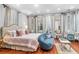 Spacious bedroom with ample natural light, seating, and a luxurious feel at 78 Society St, Charleston, SC 29401